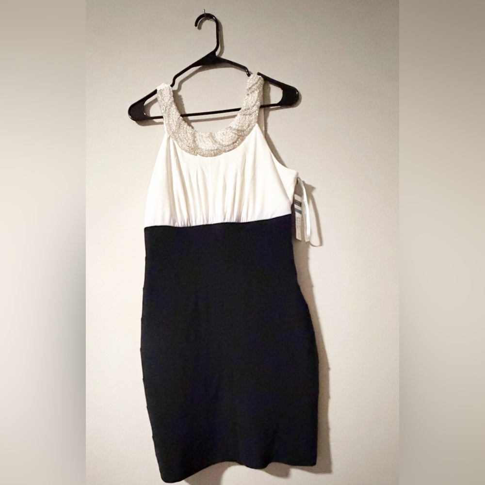 Cachet Elegant Black and White Dress with Beaded Neckline fits more like an L